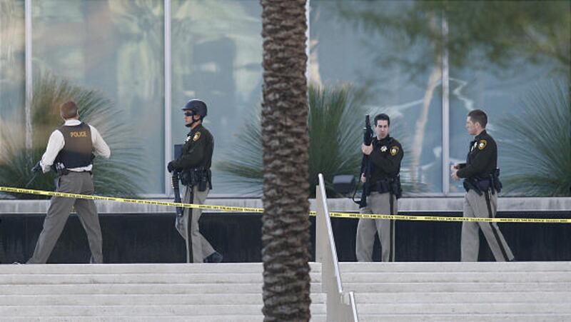 Law enforcement officers surround the Lloyd D. George federal courthouse building in downtown Las Vegas following a shooting Monday.