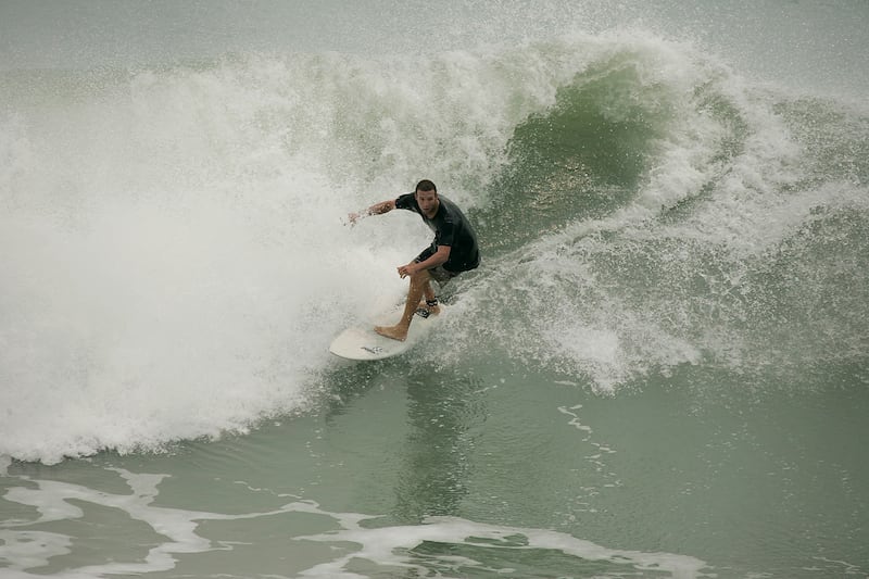 One of many surfers at Juno Beach, Fla., on May 9, 2007, take advantage of the unusually high waves coming ashore.