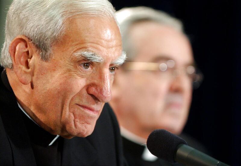 FILE - Cardinal Anthony J. Bevilacqua listens to a reporter's question as St. Louis Archbishop Justin F. Rigali, right listens at a news conference in Philadelphia in this July 15, 2003 file photo. Philadelphia.The retired Cardinal, who served as head of