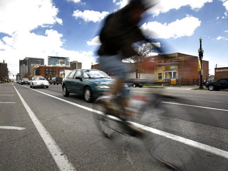 A bicyclist rides in a bike lane on a Salt Lake street. The city is seeking public input on updating its bicycle and pedestrian master plan this year.