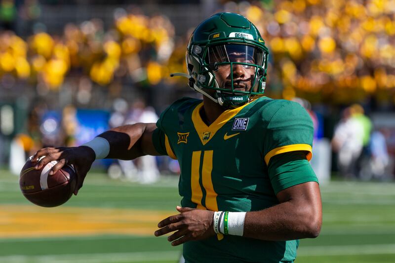 Baylor quarterback Gerry Bohanon (11) warms up on the sideline before an NCAA college football game against Texas, Saturday, Oct. 30, 2021, in Waco, Texas. (AP Photo/Sam Hodde)