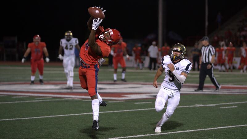 Dixie State receiver Xavier Smith (left-center) makes a 51-yard touchdown catch in the fourth quarter of the Trailblazers' 31-3 win over Fort Lewis on Saturday.