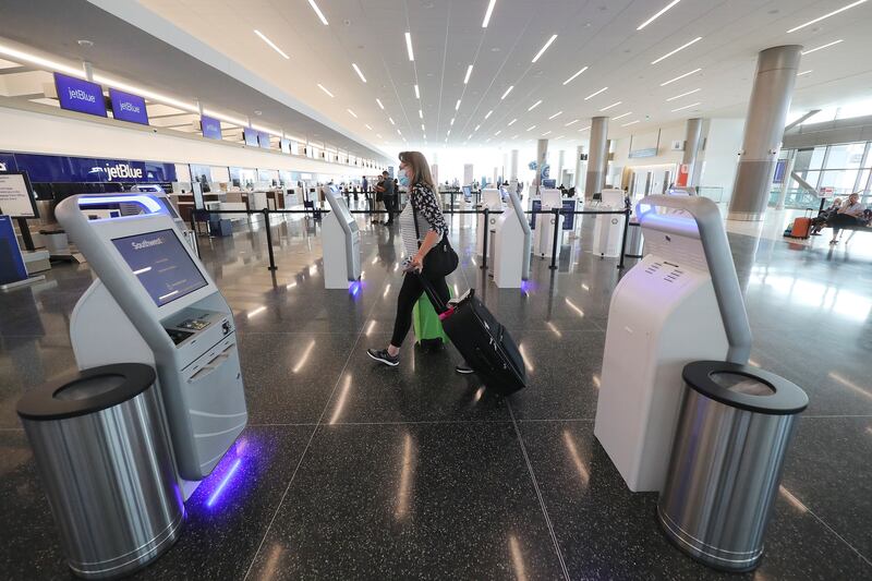 Passenger Bev Saunders checks in at the new Salt Lake City International Airport in Salt Lake City.