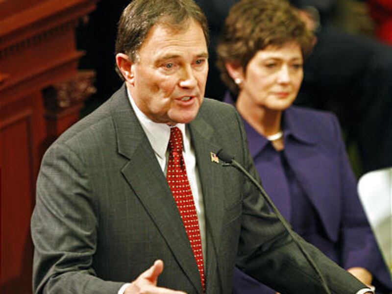 Utah Governor Gary Herbert, with his wife Jeanette behind him, gives his first State of the State speech in the House Chambers of the utah State Capitol Tuesday, Jan. 26.