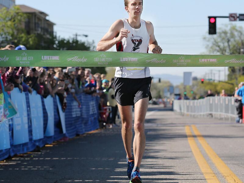 Mike Nelson of Lehi, runs for the finish line as he wins the Salt Lake City Marathon Saturday, April 18, 2015, in the Salt Lake City.