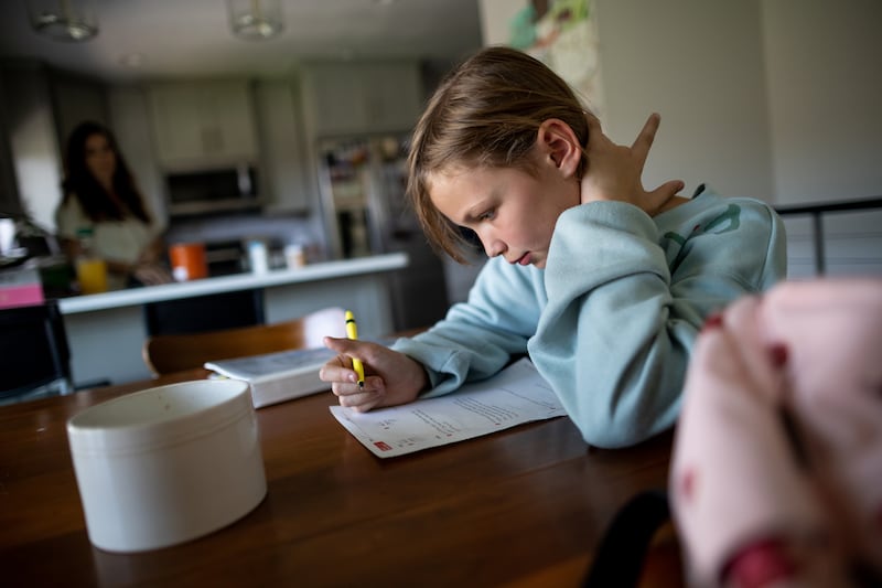 Emery Blackburn, 9, does her homework after returning from school at her home in South Jordan on Tuesday, Sept. 14, 2021.