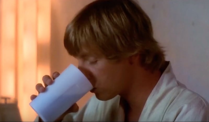 Luke drinks blue bantha milk while with his aunt and uncle.