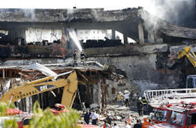 Firefighters work at the site Thursday where a TAM airlines jet crashed Tuesday killing at least 189 people in Sao Paulo. The jetliner pulled out of an attempted landing at Congonhas airport and federal prosecutors sought a court order to shut down Brazil