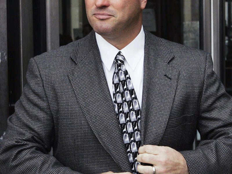 FILE - In this Nov. 14, 2006 file photo, Chicago Police Officer Jerome Finnigan leaves the Cook County Criminal Courts Building in Chicago. Finnigan, who who admitted stealing hundreds of thousands of dollars from suspected drug dealers and ordering anoth