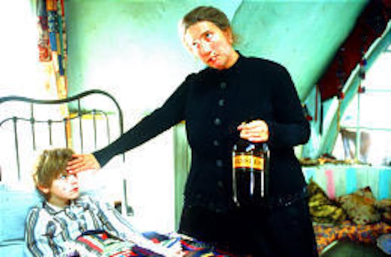 Emma Thompson as Nanny McPhee tends to the "ill" Simon (Thomas Sangster) in "Nanny McPhee."