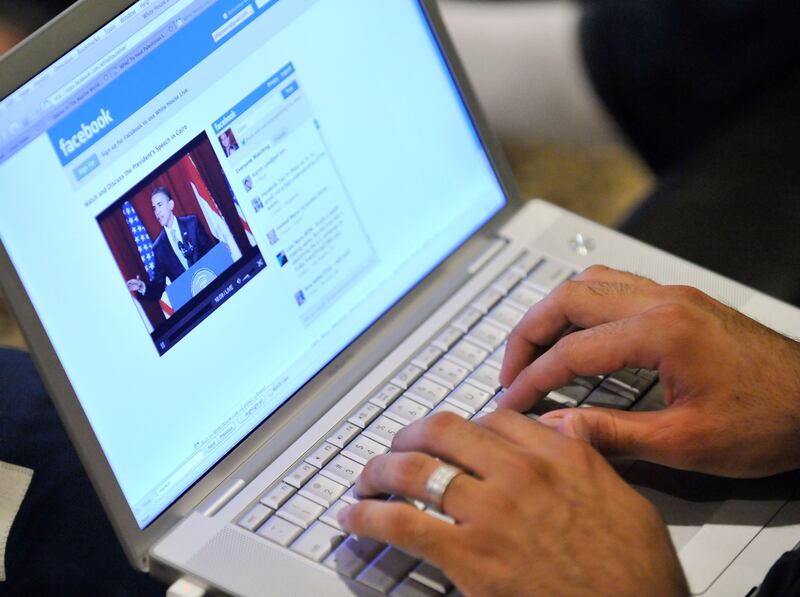 Zabie Mansoory monitors a Facebook discussion board while watching President Barack Obama's televised coverage of President Barack Obama's speech from Cairo University, in the Sylmar area of Los Angeles, early Thursday June 4, 2009.