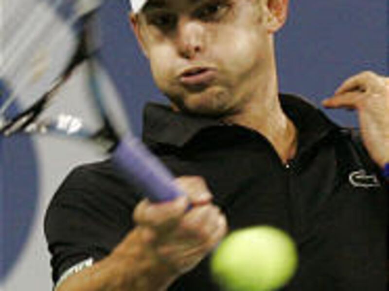 Andy Roddick hits a return during his upset loss to Gilles Muller of Luxembourg in first-round action at the U.S. Open Tuesday.