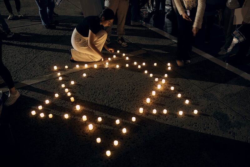 Rutgers University’s students place candles with the Star of David pattern to hold solidarity and vigil for Israel.