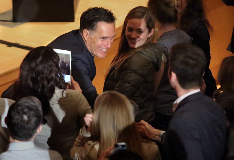 In this March 3, 2016 file photo, Mitt Romney shakes hands after addressing the Hinckley Institute of Politics at the University of Utah in Salt Lake City regarding state of the 2016 presidential race.