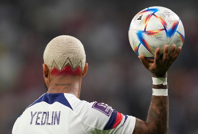 DeAndre Yedlin of the United States holds the ball during the World Cup match in Qatar.