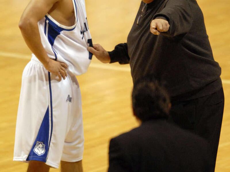 Saint Louis' coach Rick Majerus, right, points to the bench as he makes a substitution for Paul Eckerle, left, during the first half of a college exhibition basketball game against Missouri-Saint Louis, Friday, Nov. 2, 2007, in St. Louis. The game marked