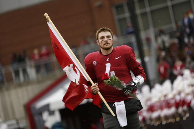 Washington State quarterback Luke Falk (4) runs onto the field during senior day activities before an NCAA college football game against Stanford in Pullman, Wash., Saturday, Nov. 4, 2017.