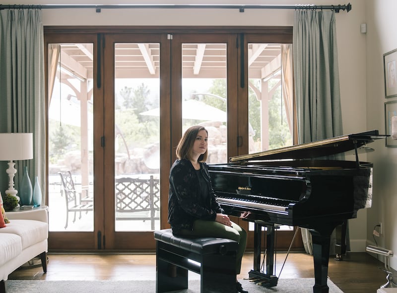 Whitney McPhie Griffith poses for a photo in her sister's home, where she lives in the guest house, in Los Altos, California, on Wednesday, April 4, 2018.