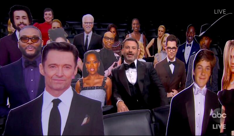 In this video grab captured on Sept. 20, 2020, courtesy of the Academy of Television Arts & Sciences and ABC Entertainment, host Jimmy Kimmel speaks surrounded by cardboard cutouts of actors in the audience during the 72nd Emmy Awards broadcast.