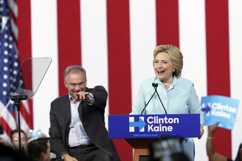 FILE - In this July 23, 2016 file photo, Democratic presidential candidate Hillary Clinton, accompanied by her running mate, Democratic Vice Presidential candidate Sen. Tim Kaine, D-Va., speaks at a rally in Miami. The Democratic National Convention speak