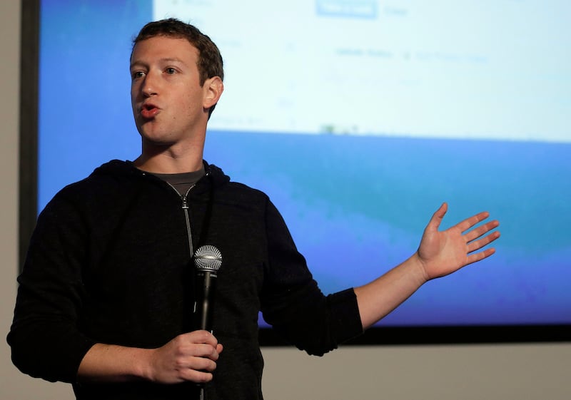 Mark Zuckerberg speaks at Facebook headquarters wearing a black jacket in 2013.