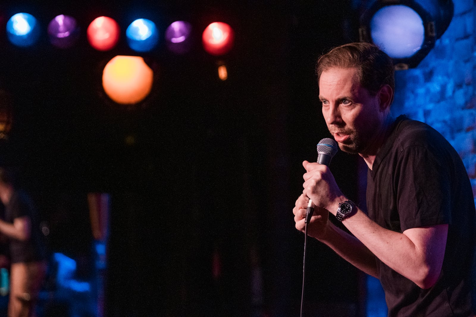 Comedian Ryan Hamilton performs at the Village Underground in Manhattan, New York in 2023.