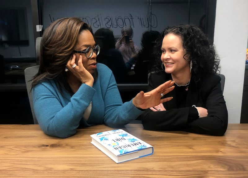 Oprah Winfrey, left, and “American Dirt” author Jeanine Cummins appear in Tucson, Ariz.
