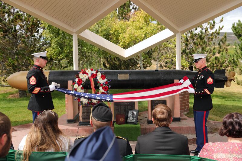 Marine Gunnery Sgt. Christopher Chambers and Sgt. Mark Maxfield fold the flag during services for Vietnam War veteran Richard Burgess during services at Camp Williams in Bluffdale on Friday, July 26, 2019.