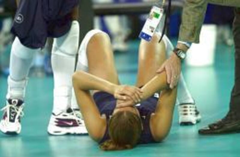 Ex-Highland High star Logan Tom is consoled following the U.S. volleyball team's five-game loss to Russia in the Olympic semifinals.