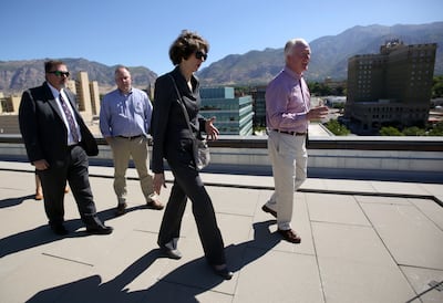 Susan Combs, Interior Department's assistant secretary for policy, talks with Kenneth Lee, right, partner with The Bennett Group, while touring the roof of the James V. Hansen Federal Building in Ogden on Tuesday, Aug. 28, 2018.