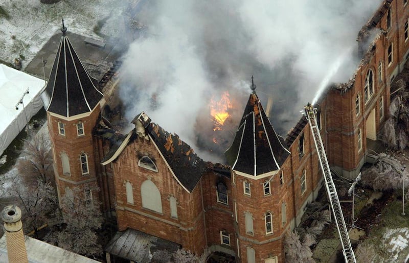 FILE - In this Dec. 17, 2011 file photo the LDS Provo Tabernacle burns as fire fighters try and knock down the flames in Provo, Utah. A final report is expected to be released Thursday March 31,2011, on the massive blaze that destroyed the historic Provo
