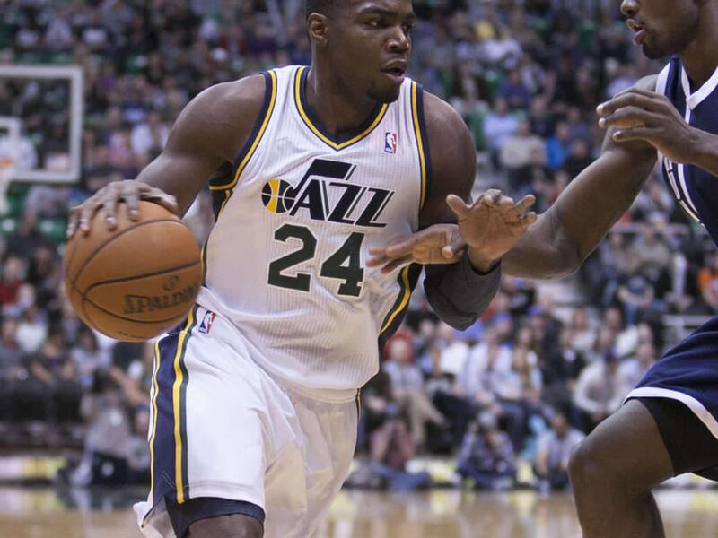 Utah's Paul Millsap drives on Serge Ibaka as the Jazz and the Thunder play Tuesday, Feb. 12, 2013 in Energy Solutions arena.
