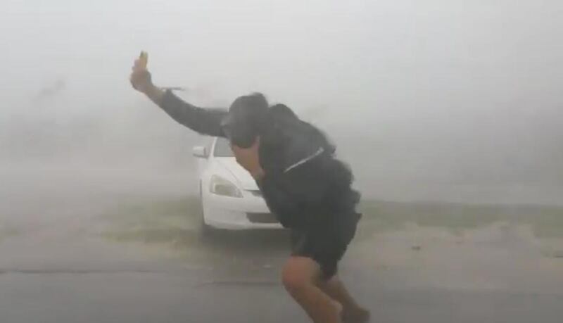 A storm chaster attempts get a reading on Hurricane Irma.