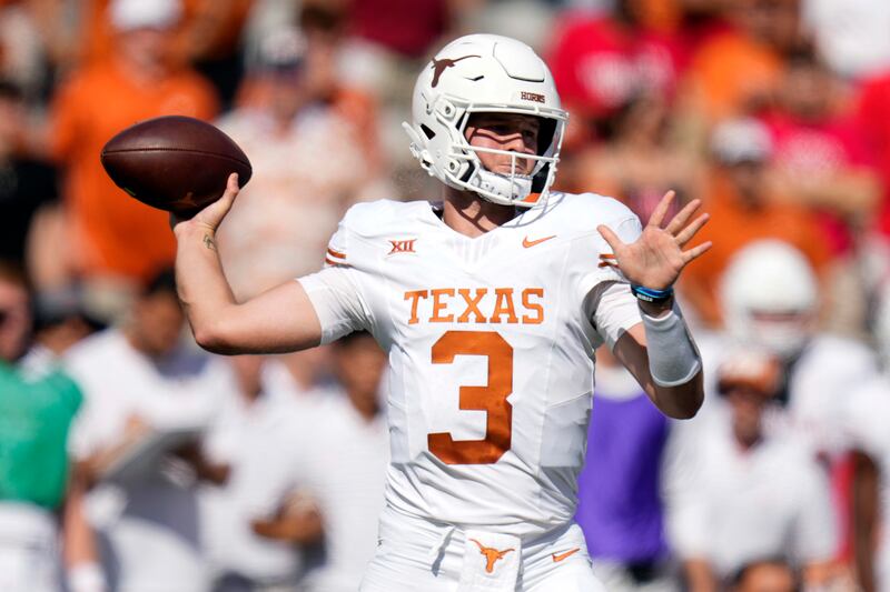 Texas quarterback Quinn Ewers looks to throw a pass during the first half of an NCAA college football game against Houston.