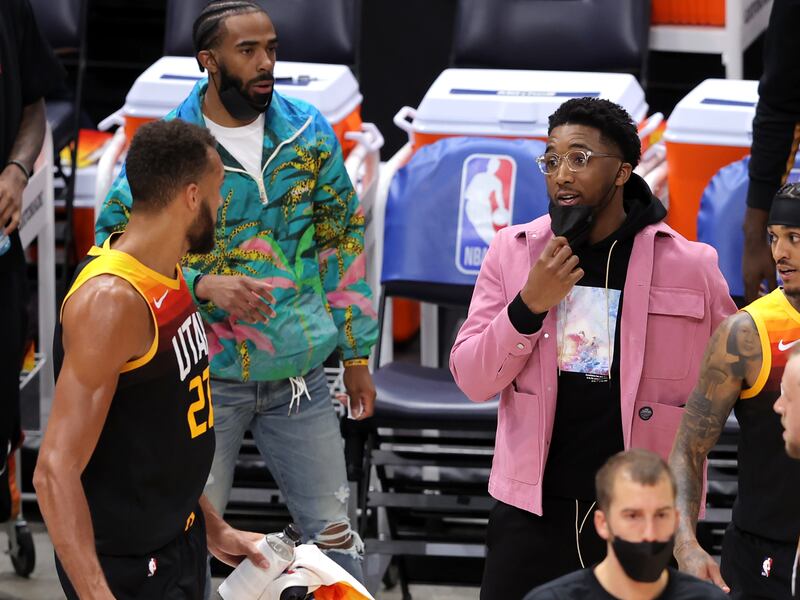 Utah Jazz center Rudy Gobert and teammate Donovan Mitchell talk as Mike Conley looks on during game May 12, 2021.