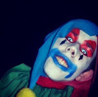 Taylor Lewis worked as a clown at Cornbelly's Insanity Point in 2011.