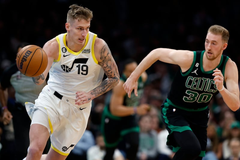 Utah Jazz’s Luka Samanic dribbles past Boston Celtics’ Sam Hauser