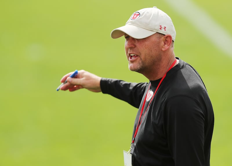 Utah Utes offensive coordinator Troy Taylor instructs players during practice in Salt Lake City on Aug 2, 2018.