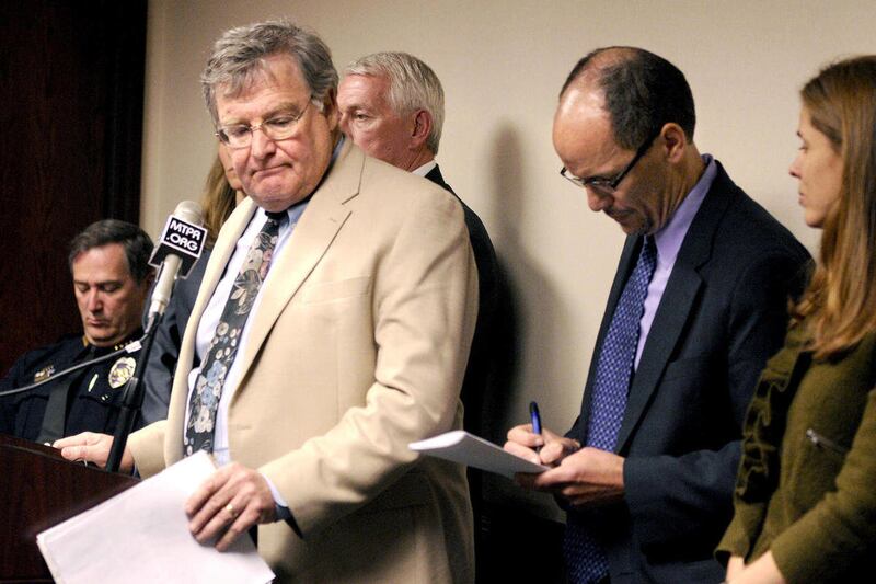 Missoula County Attroney Fred Van Valkenburg, left, steps away from the podium Tuesday, May 1, 2012 after blasting the U.S. Department of Justice's announcement of a series of investigations into the response of the University of Montana and law enforceme