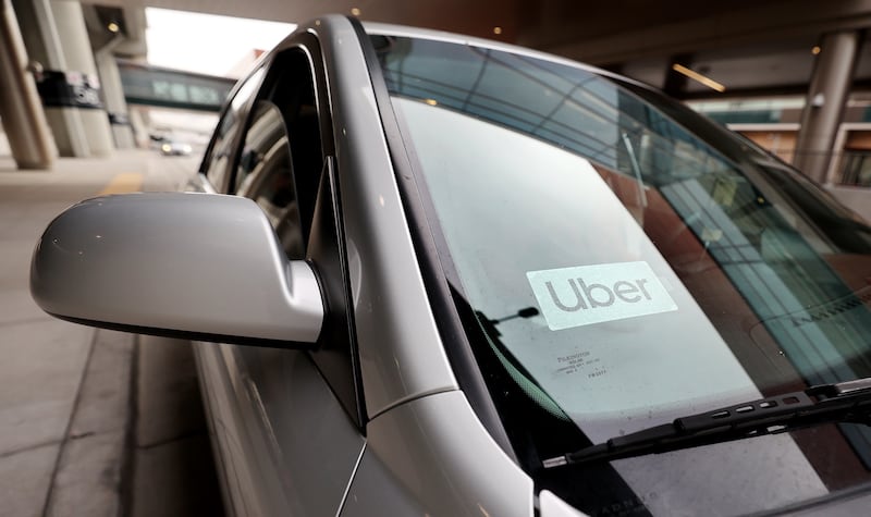An Uber driver waits to pick up a passenger at the Salt Lake City International Airport on Feb. 1, 2021.