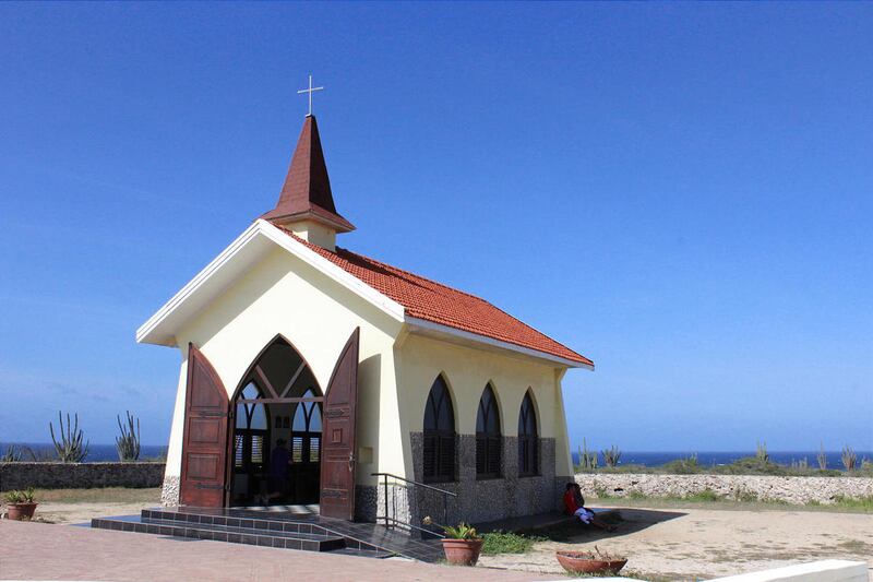 The picturesque Alto Vista Chapel in Aruba is perched on the island's windswept shoreline.