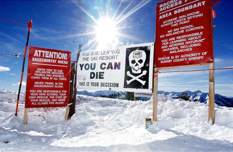 Signs and a gate warn that it is very dangerous to pass the top of the 9990 ski run at The Canyons ski area on Jan. 15, 2005.
