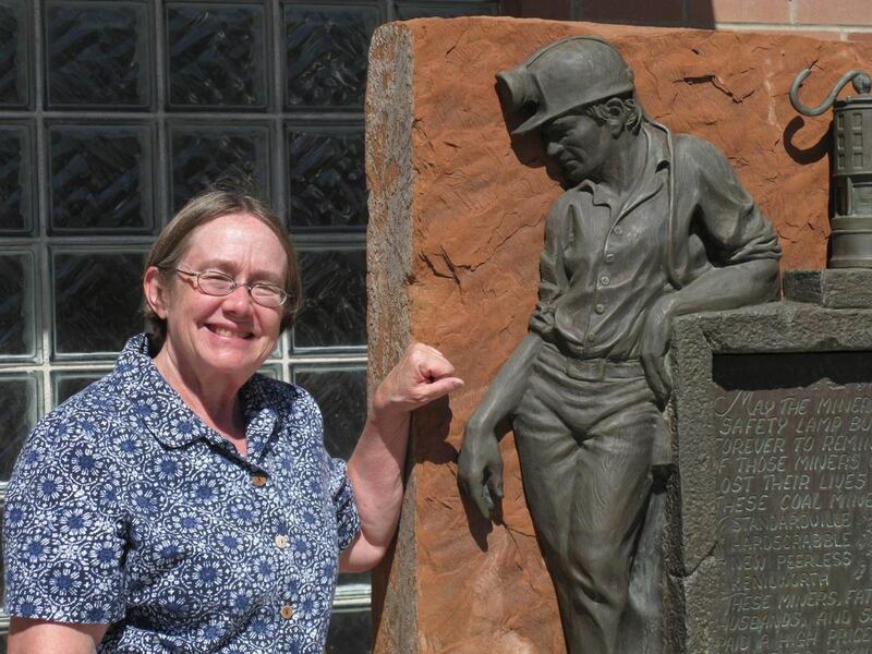 Carla Kelly, shown outside the mining museum in Helper, has written a novel about one of the country's worst underground disasters.