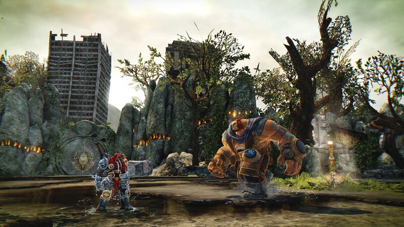 War prepares for battle against a troll in "Darksiders Warmastered Edition."