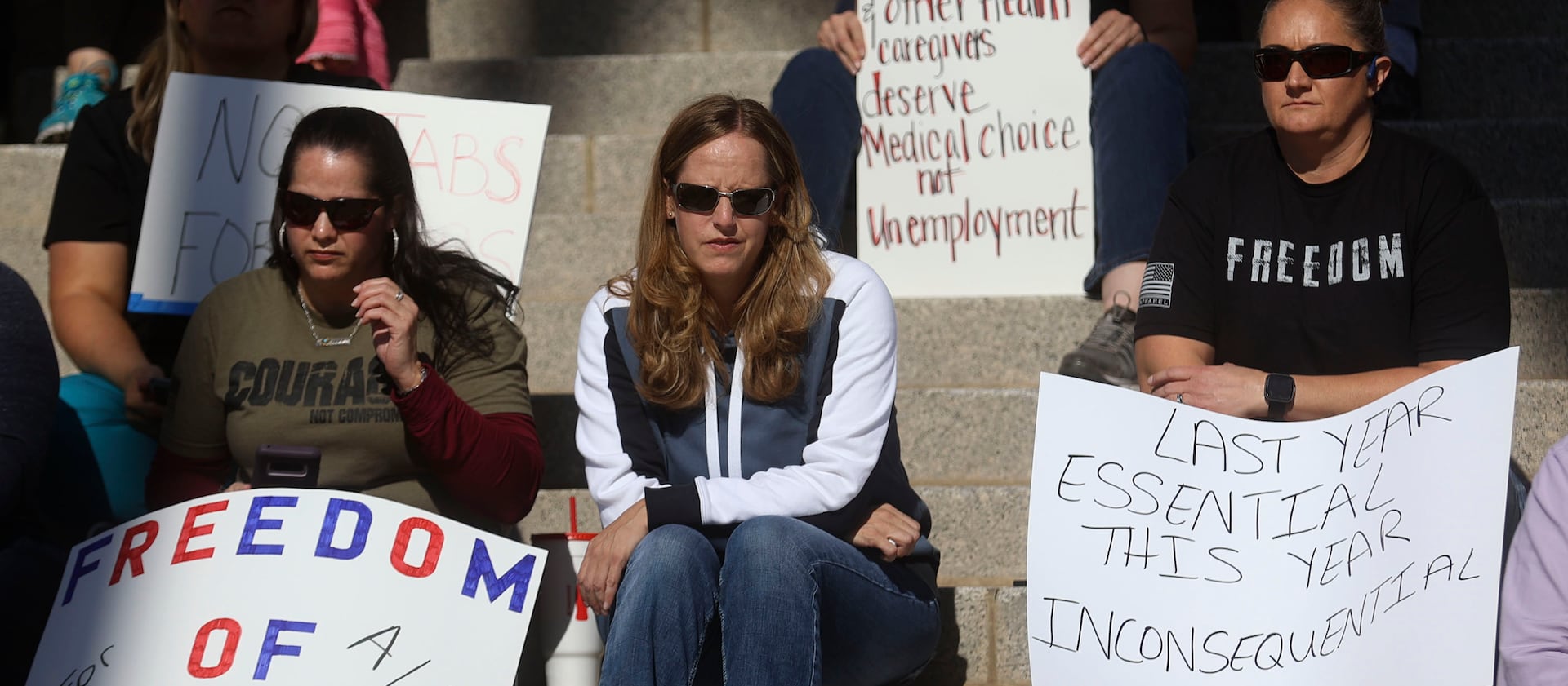Protesters oppose a vaccine mandate outside of the Capitol in Salt Lake City.