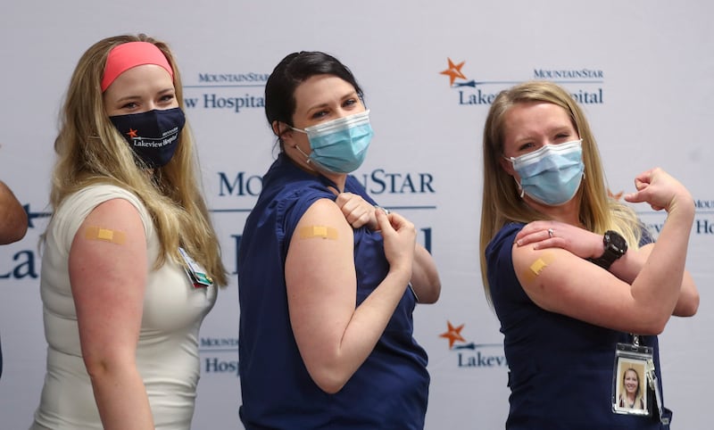 Lakeview Hospital nurses Becca Fackrell, Liz Barnes and Jacci Kennedy pose after they received the Moderna COVID-19 vaccine