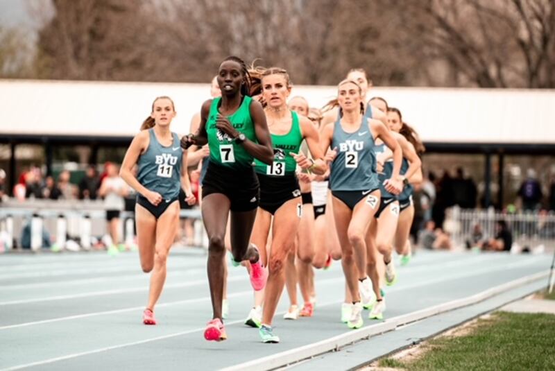 Utah Valley University runner Everlyn Kemboi, wearing green, runs