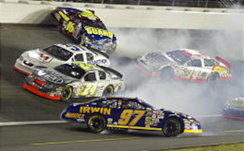 Kurt Busch (97) and Greg Biffle (16) spin in turn one as Jeff Gordon (24), Tony Raines (51) and John Andretti (14) drive past during the NASCAR UAW-GM Quality 500 in Concord, N.C., Saturday.