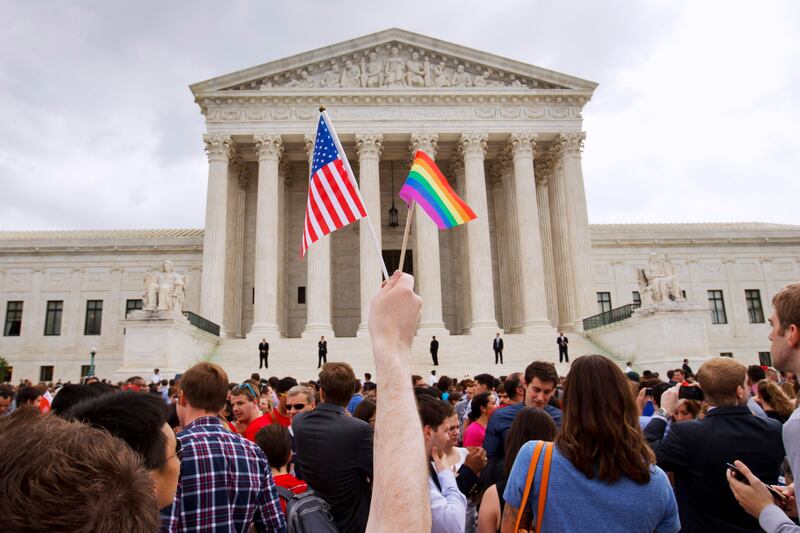 A crowd celebrates outside of the Supreme Court in Washington after the court declared that same-sex couples have a right to marry anywhere in the U.S.