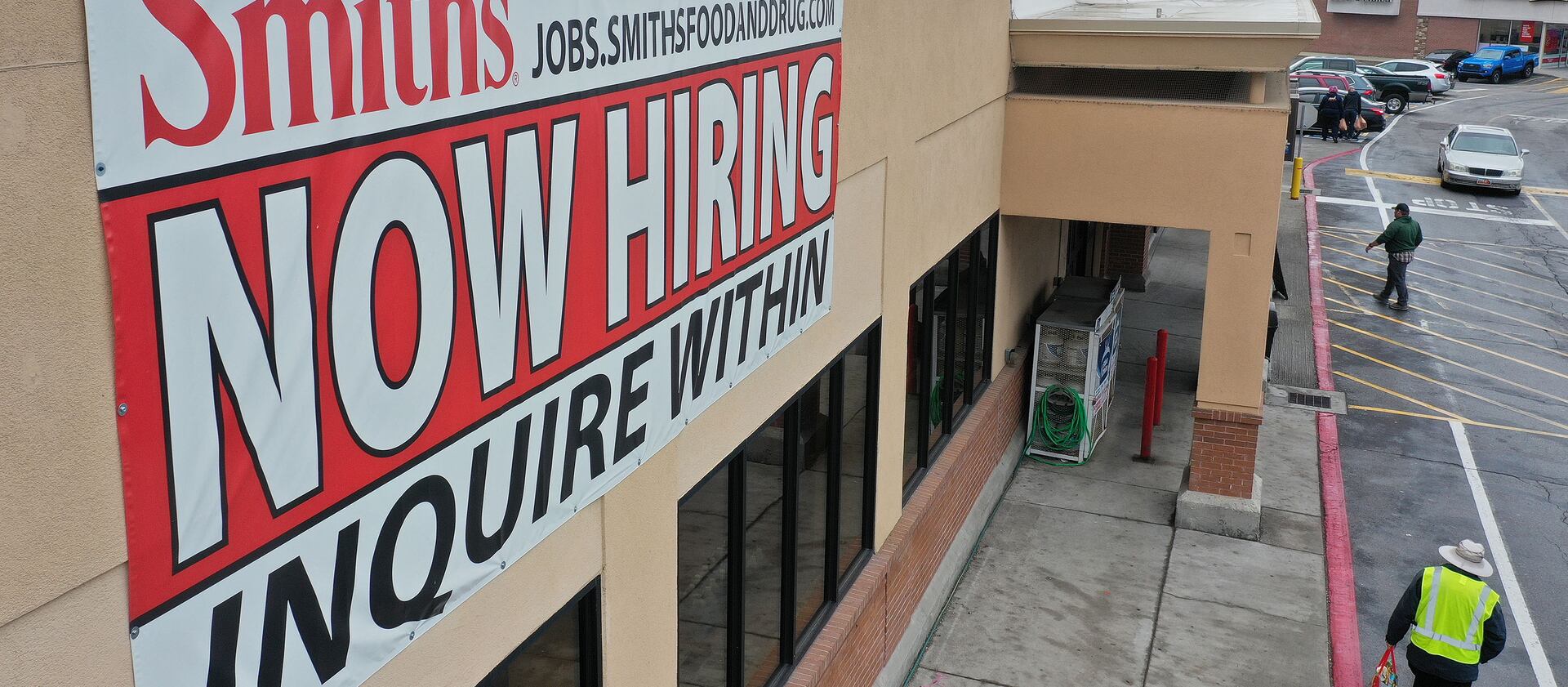 A “now hiring” sign at a Smith’s in Cottonwood Heights is pictured on on Friday, Jan. 21, 2022.